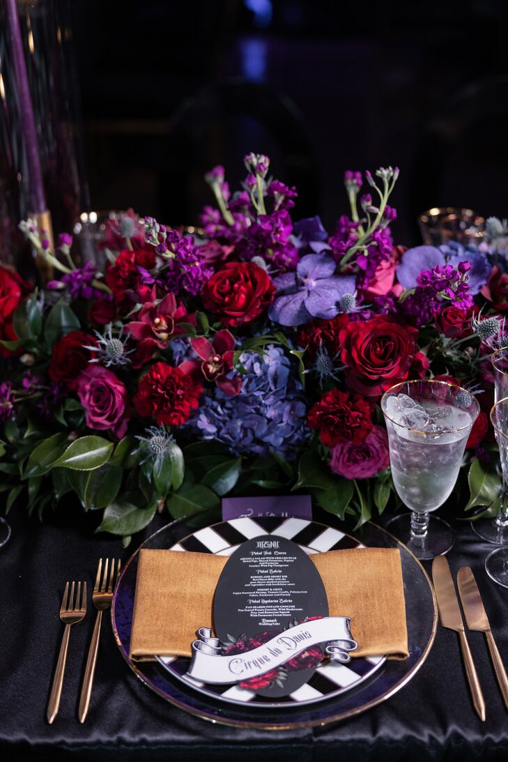 The centerpieces at this wedding included roses, hydrangeas, orchids, and thistles.