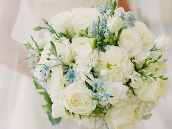 Stumped on picking a "something blue?" Consider choosing flowers in a blue hue for a pretty bouquet that's also a nod to this tradition.