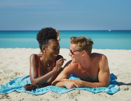 A happy young couple on their beach honeymoon 