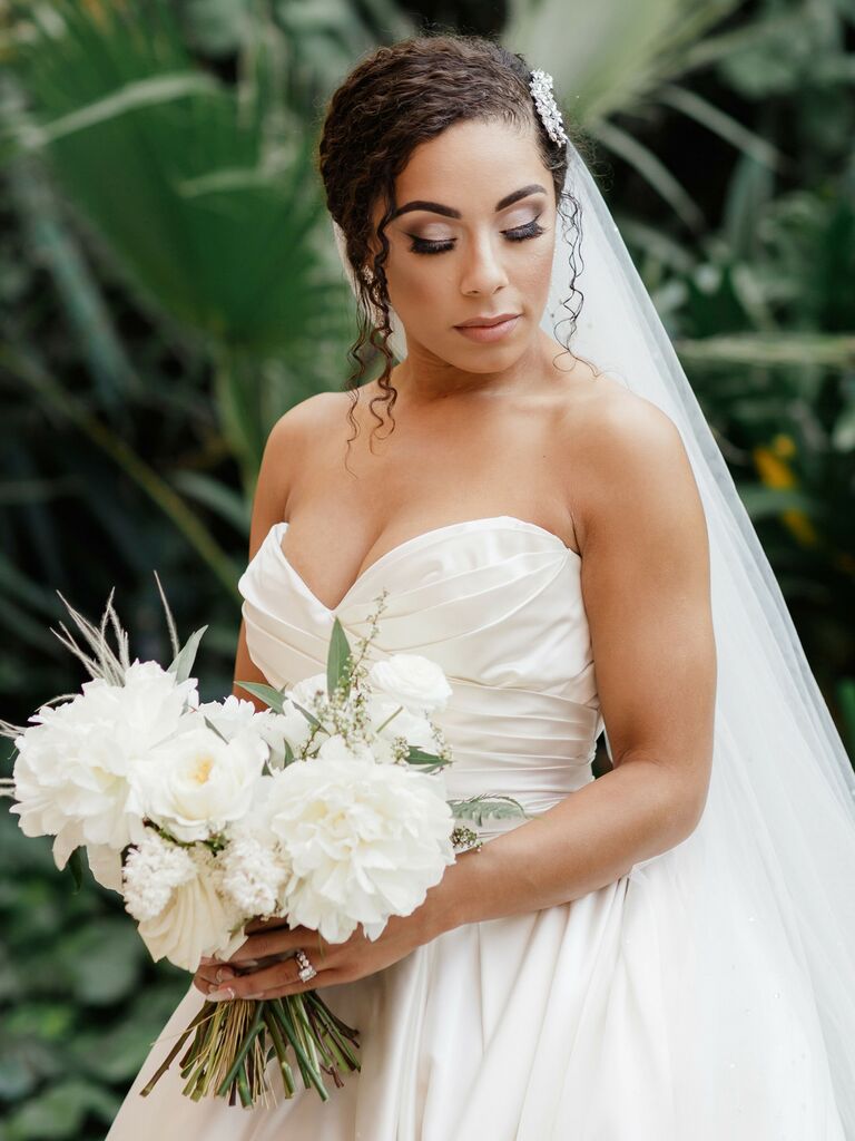 wedding updos low bun with sparkly hair piece
