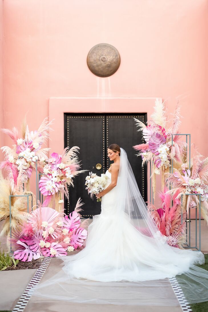 Bride in Classic Tulle Gown and Long Veil at Pink Ceremony Altar With Pampas Grass, Palm Leaves