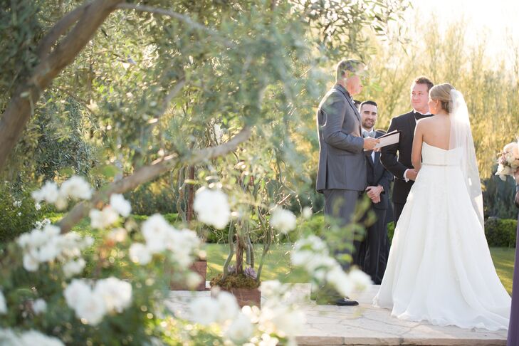 Kathleen and Aaron personalized their ceremony by both writing their own vows and providing guests with ribbon and bell wands for guests to wave at the end of the ceremony. “We wanted the ceremony to be personal to the two of us,” says Kathleen. “Ringing bells at a wedding is a good luck sign and an old Irish tradition.”
