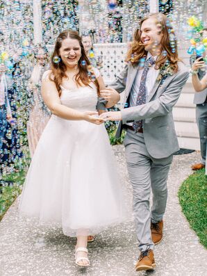 Bride in Tea Length Vintage Wedding Dress and Groom in Light Gray Suit Bubble Grand Exit