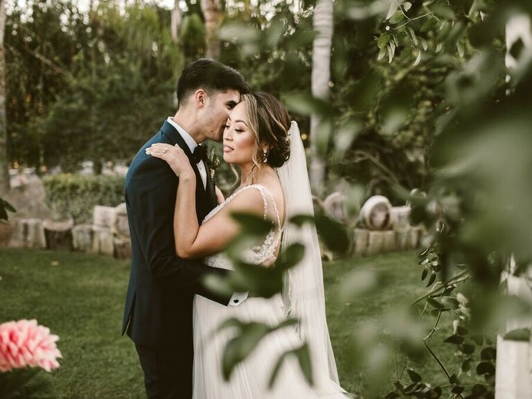 Bride with her hair in a loose and romantic updo. 