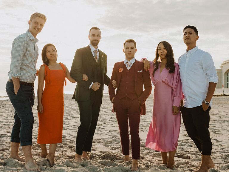 Wedding guests dressed in beach formal attire at outdoor beach wedding