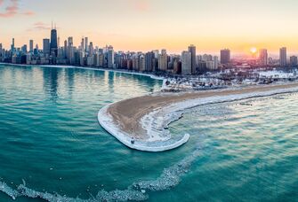 The sun sets over the waterfront in Chicago, IL.