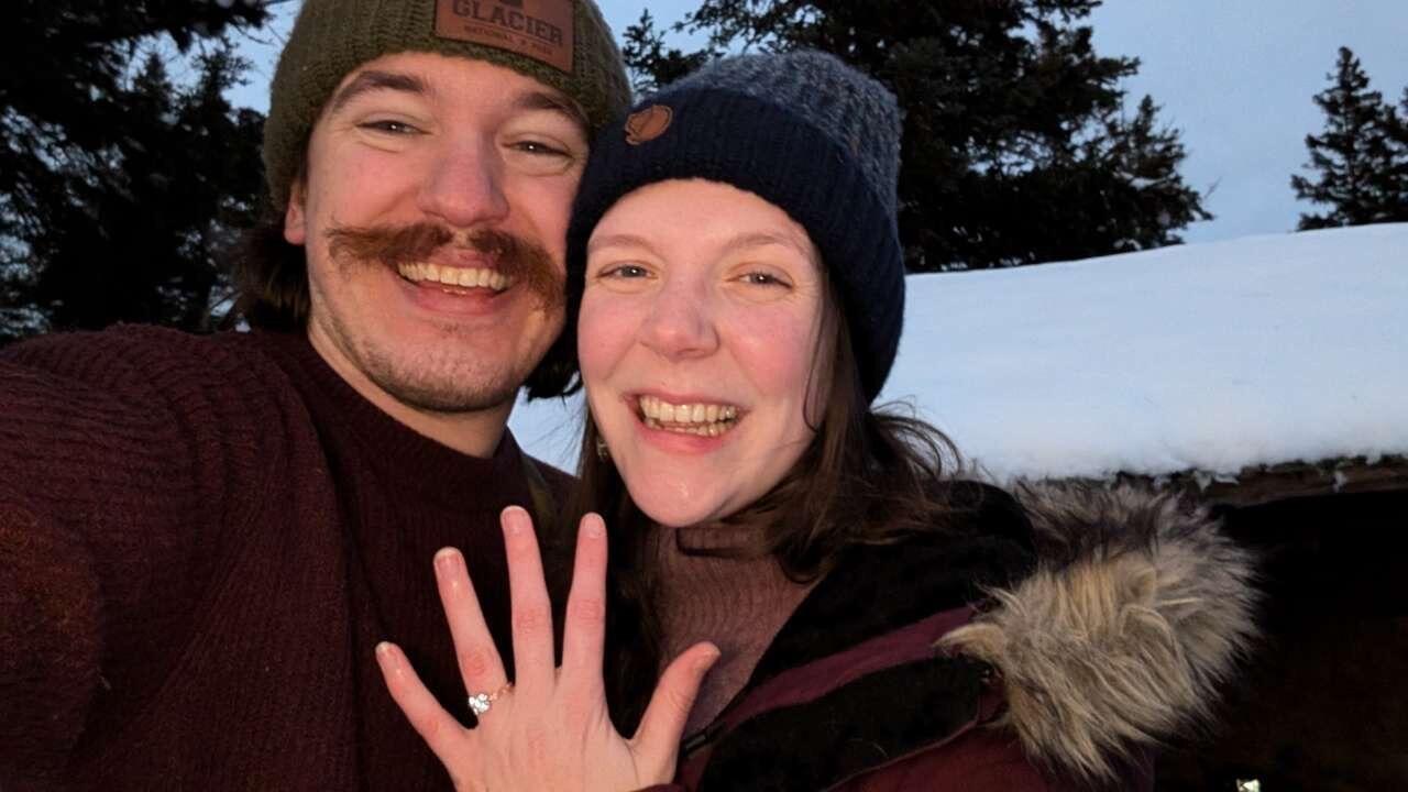 The day we got engaged on December 10th, 2024. 

The days leading up to the engagement, we had gone on our annual winter hiking trip up north in Grand Marais, MN with our entire friend group. Unbeknownst to Jen, everyone on the hiking trip knew of the pending engagement except her. Jen and Jim made plans to stay with their other friends in Duluth after the hiking trip in Grand Marais before they head home, or so Jen thought. Unfortunately, on the drive down to Duluth, a massive blizzard hit, and Jim couldn’t even see the roads. They drove with their hazards on, going maybe 30 miles per hour in their small all wheel-drive vehicle.  They were driving blind, with Jen calling out curves in the road based on Google Maps. They made it to Beaver Bay, which would normally be an hour drive, in three hours. It had become impossible to proceed without an impending crash. They oaid for a one-night stay  at the Cove Point Lodge and spent their night by fire, decorating silly Christmas ornaments depicting the terrifying drive. 

They finally reached Duluth the next day to visit their friends. Instead of heading home, Jim suggested they do the hike they do every year in Two Harbors, MN, that they conveniently ran out of time to do on the way up to Grand Marais. Jen of course was very excited to get to squeeze this last hike in. It was a 1-mile hike straight up-hill to a cliff overlooking Lake Superior and the beautiful expanse of northern pines. Jim used to come to this spot every fall with his dad to hunt deer, and Jen was the first person he ever showed this spot to. There is a small wooden structure as seen in the picture that Jim and his dad used to drink hot cocoa under. Then it became a place Jim and Jen would stop at every single year to kick off their annual hiking trip. 

On the hike up, Jim made Jen carry a tripod for his video camera as he wanted to get some “cool shots.” Not completely out of the ordinary as he had been videotaping many hikes before, but the tripod went completely over her head. At the top of the hill, they stood where they had many times before, and Jim asked Jen to marry her. She was unfortunately wearing her glasses and was crying and laughing so much she couldn’t even see the ring. They joked that they left their boyfriend and girlfriend at the top of the mountain. They spent the next three days at a surprise A-frame cabin nearby, where they got to call all their family and tell them the news. 
