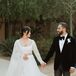 Bride in Lehenga Holding Hands With Groom in Tux