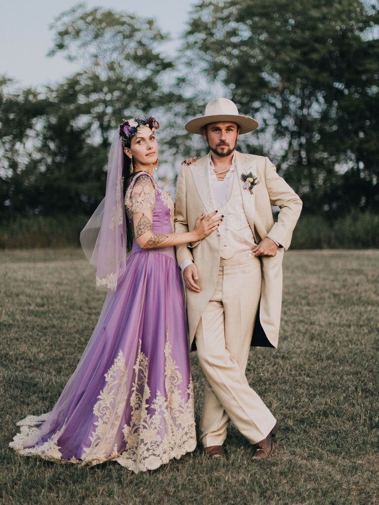 Groom wears a 70s-inspired suit. 