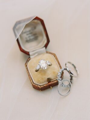 Luxurious Engagement Ring in Vintage Box With Wedding Bands Beside