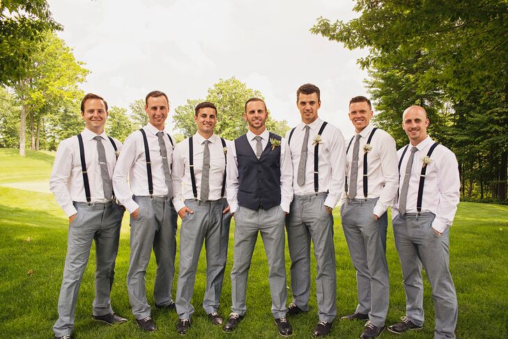 Each of the groomsmen wore gray pants with navy, oxford shoes along with a light gray tie and navy suspenders from Banana Republic.