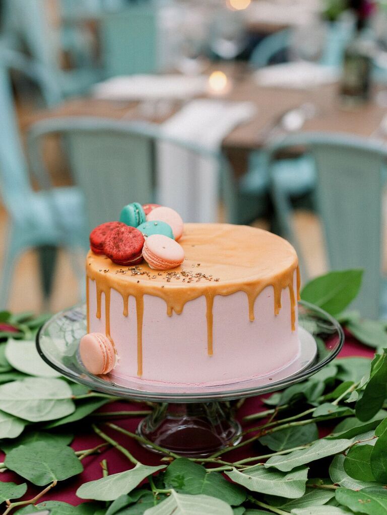 one tier wedding cake with caramel glaze and macarons