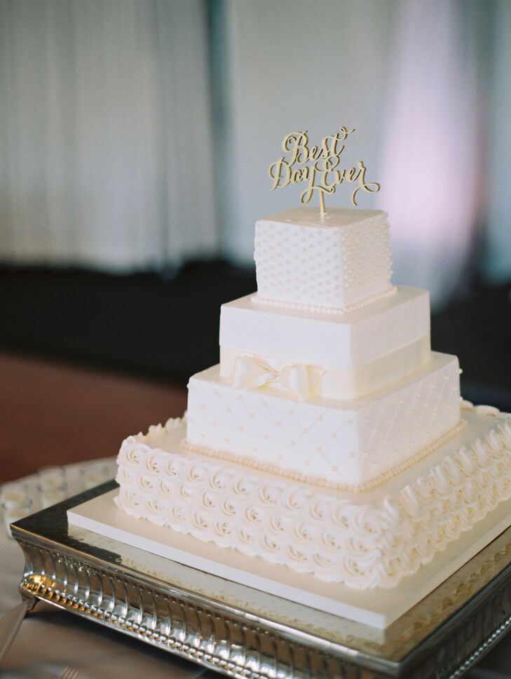 The wedding cake consisted of four square tiers, each with a different pattern: rosettes, quilted, gift-wrapped and beaded. “I designed the look for the baker, Bridal Cakes by Ann, and she created it perfectly!” The cake topper read “Best Day Ever”—"it truly was,” says the bride.