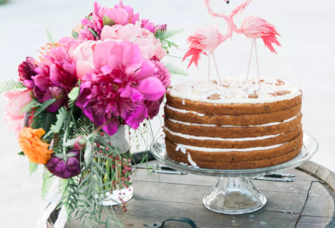 Pink Flamingo bridal shower cake with pink flower bouquet