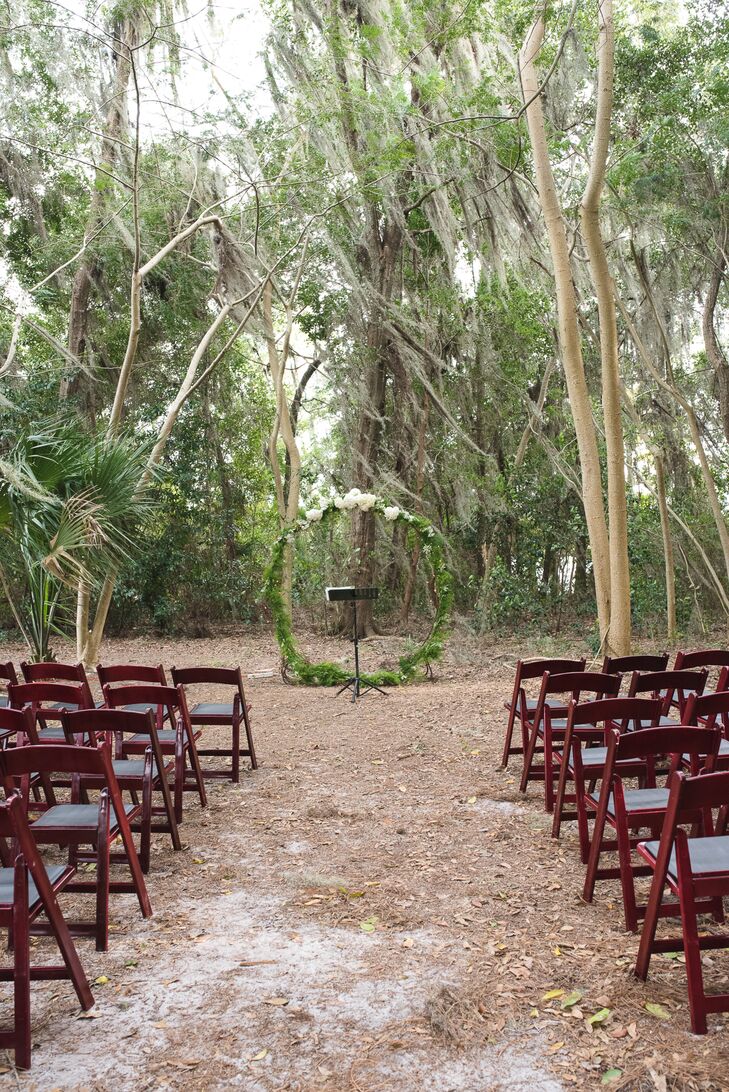 The couple's backyard ceremony was decorated simply to highlight the natural beauty of the wooded space on Lake Brantley in Longwood, Florida. A friend's guitar teacher played acoustic music for the processional, and a friend was ordained to act as the officiant.