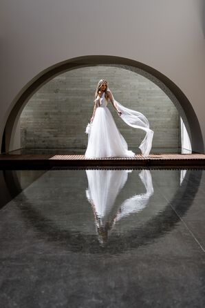 Bride in A-Line Tulle Gown, Flowing Veil on Bridge Over Reflection Pool