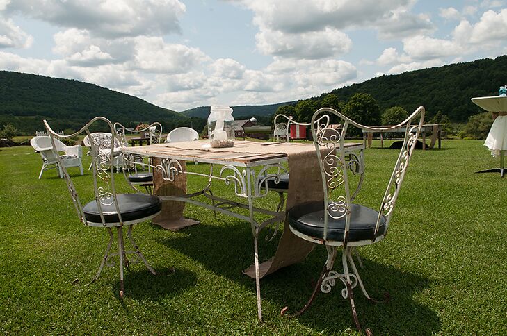 Mary and Sam's cocktail hour took place outside on the field at the Maple Shade Farm where guests sat at mismatched, vintage-style tables.