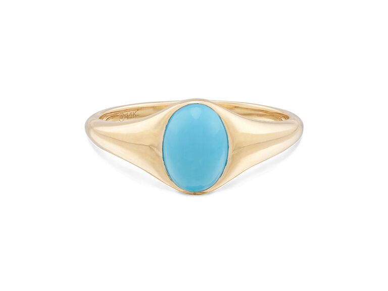 Oval turquoise center stone with gold band