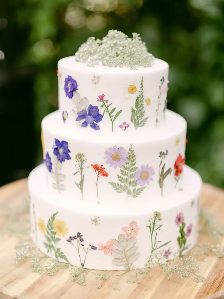 Three-tier wedding Cake With Fresh Flowers