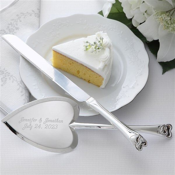 Heart-shaped cake cutting set by Personalization Mall. 