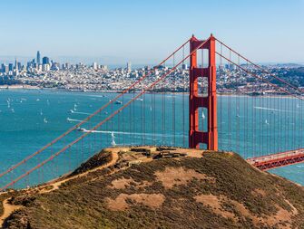 san francisco golden gate bridge overlooks city skyline