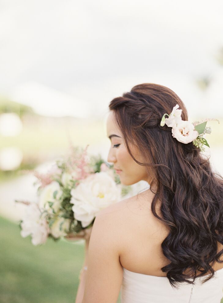 As she usually does not wear makeup, Joyce opted for a natural look, She wore her hair down and in a curls with a simple braid. “During the ceremony, we incorporated a few flowers hugging the braid as well,” says Joyce.