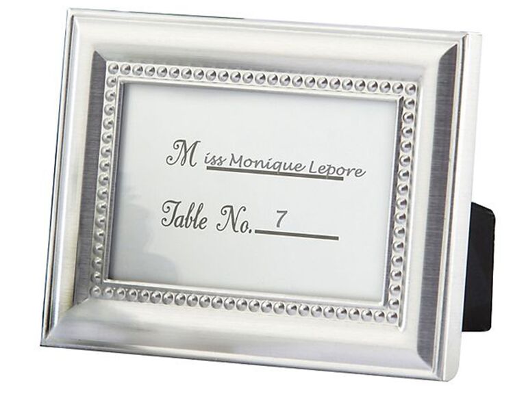 Silver beaded frame with guest name and table number inside