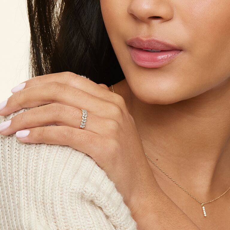 dual rows of alternating marquise- and round-cut diamonds and a split shank band in leaf design