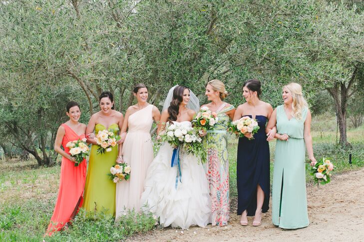 "My bridesmaids wore a mix of dresses that I handpicked for them," Carly says. "I chose my maid of honor's dress—a print fabric—and then pulled colors from her dress for my other bridesmaids for a cohesive look."
