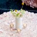 White Centerpiece on Pink Petal Tablecloth