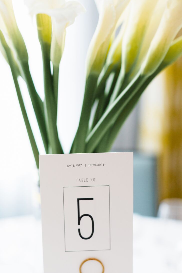 At the reception at the Confidante in Miami Beach, Florida, each table was topped with a simple clean vase of calla lilies and a sleek table number.