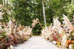 Bohemian Ceremony Site with Triangular Wedding Arch and Dried Grasses