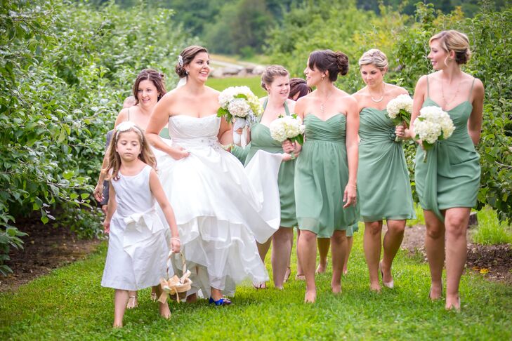 Emily's bridesmaids each chose their own chiffon dress from Alfred Angelo in sage green."I loved that they each had their own style," she says.