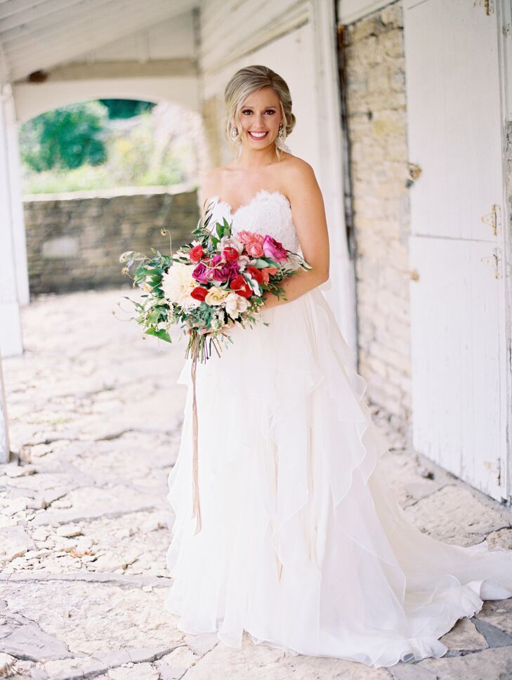 "Since we were having a summer wedding outdoors, I really wanted a dress that wasn’t stuffy," says Kristina. "I really wanted a soft, ethereal look and feel for my dress without going too far outside my normal style." After visiting several shops and trying on over 50 different dresses, Kristina decided to take to the internet to gather some inspiration. She came across Hayley Paige's designs and knew she had to try one on. "Once I did, I was hooked. My gown had beautiful movement in the skirt without it being too big and puffy. Then the rope lace design on the bodice was a perfect little vintage touch. I could instantly see it in the barn setting," says Kristina.