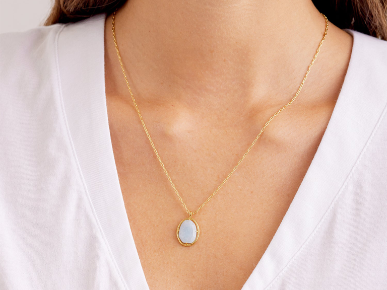Light blue raw-cut gemstone on gold chain