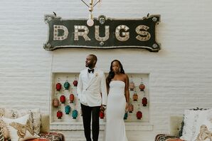 Groom in Whit Tuxedo Jacket and Bride in Sleek, Strapless Gown in Front of Vintage Pharmacy Drugs Sign at Palm Springs Hotel