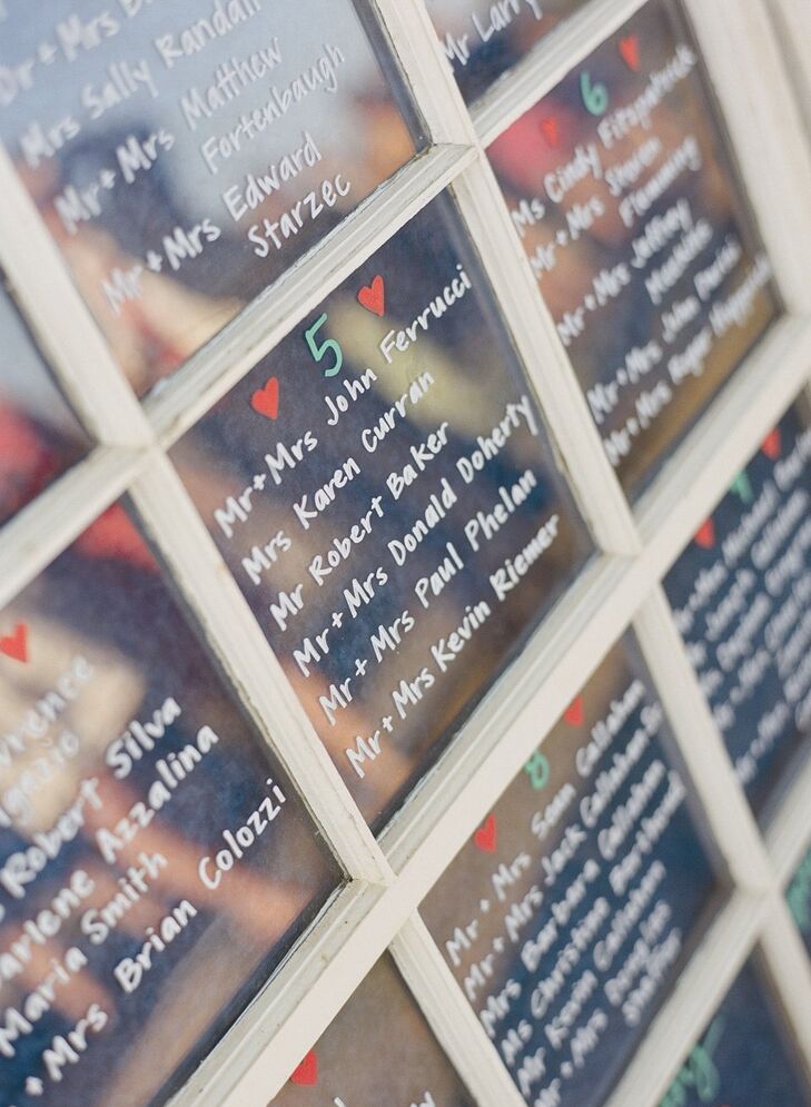 Caitlin's friend Kate wrote out the seating assignments on three old window panes that the couple had purchased from a salvage yard.