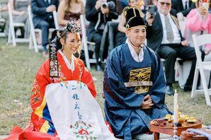 Bride and Groom Kneeling in Korean Attire at Religious Paebaek Ceremony