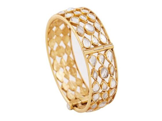 Gold bangle with sparkling crystals. 
