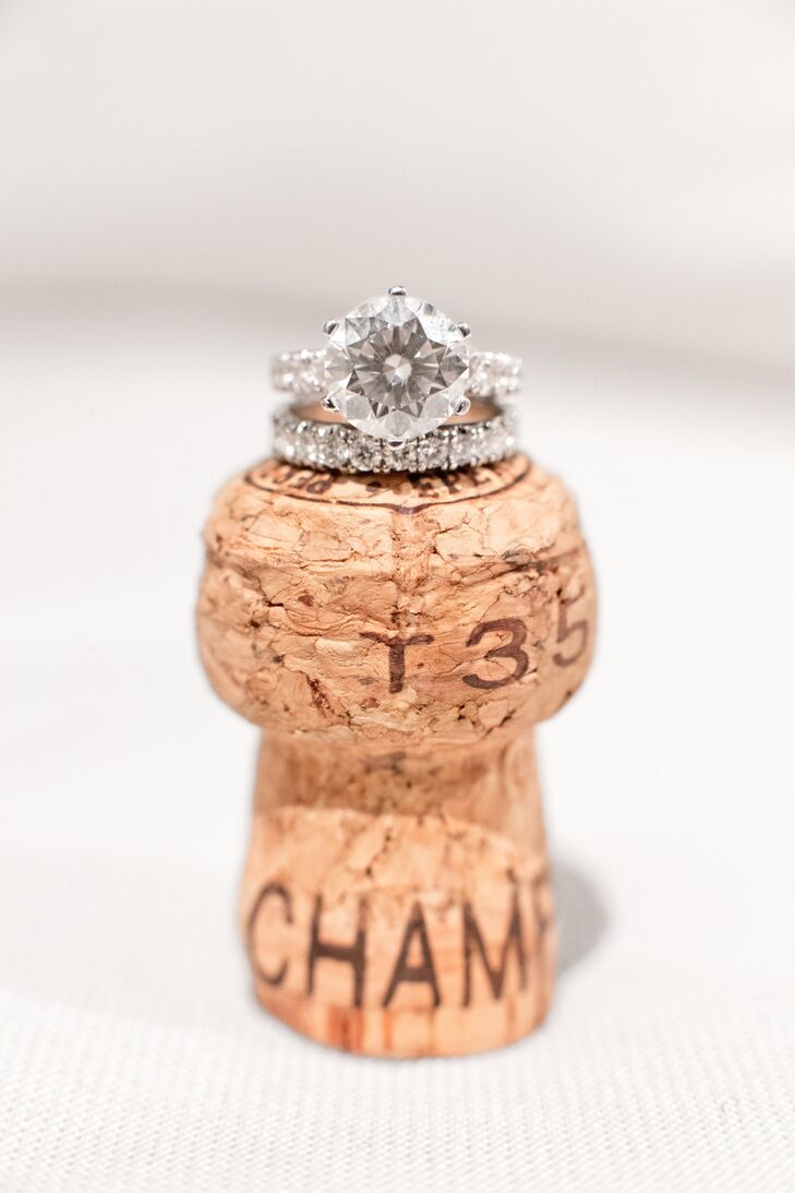 Mackenzie's custom made round-cut diamond wedding ring was placed on top of a champagne cork to expand on her French winery theme.