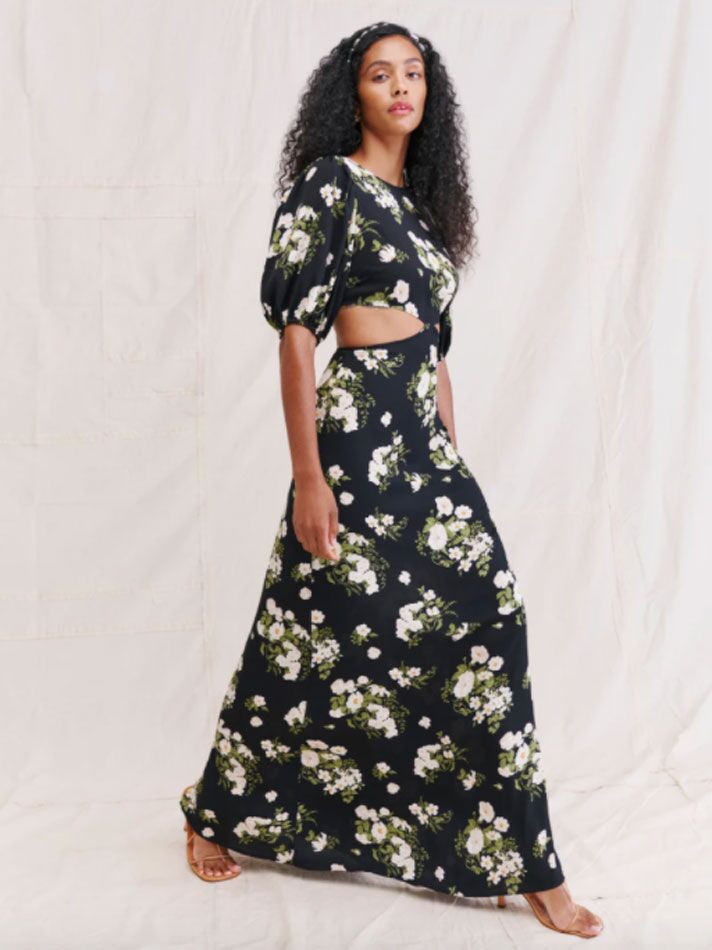 Black floor-length fall wedding guest dress with puff sleeves and side cutouts