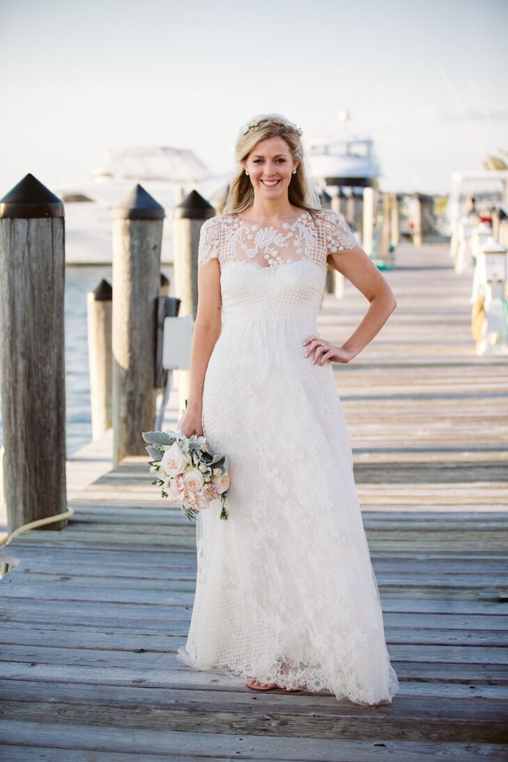 While Jill says that her gown was not what she originally pictured herself getting married in, the gorgeous Monique Lhuillier design suited both her personal and wedding style perfectly. The standout feature of the elegant A-line gown was the unique lace and lattice overlay and illusion neckline that offered a contemporary twist on the classic fabric. The lattice captured the essence of the netting used in fishing, tying in perfectly to the wedding’s seaside locale and nautical theme.