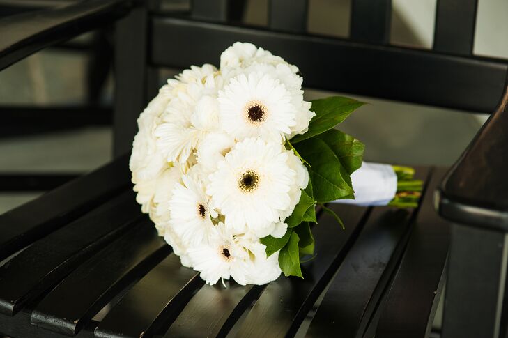 The bride carried an all white bouquet of large gerbera daisies mixed with small seasonal flowers.