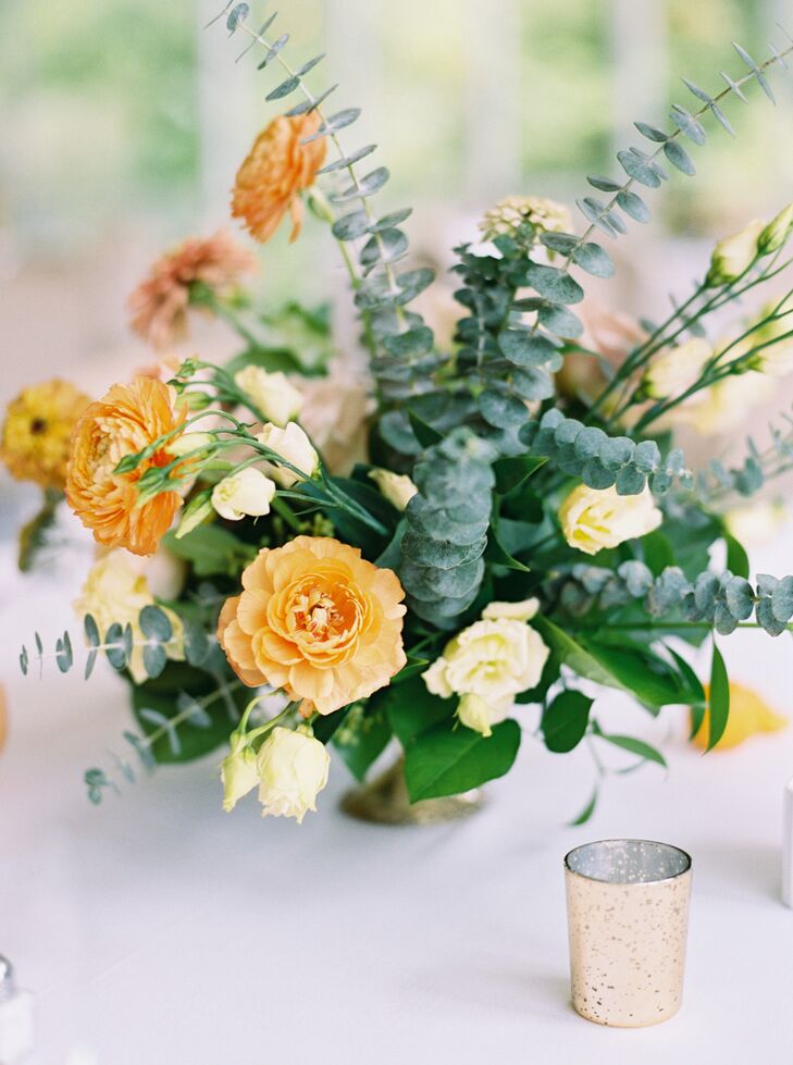 Centerpieces of Zinnias, Ranunculus, Roses, Yarrow, Oranges and Grapefruit