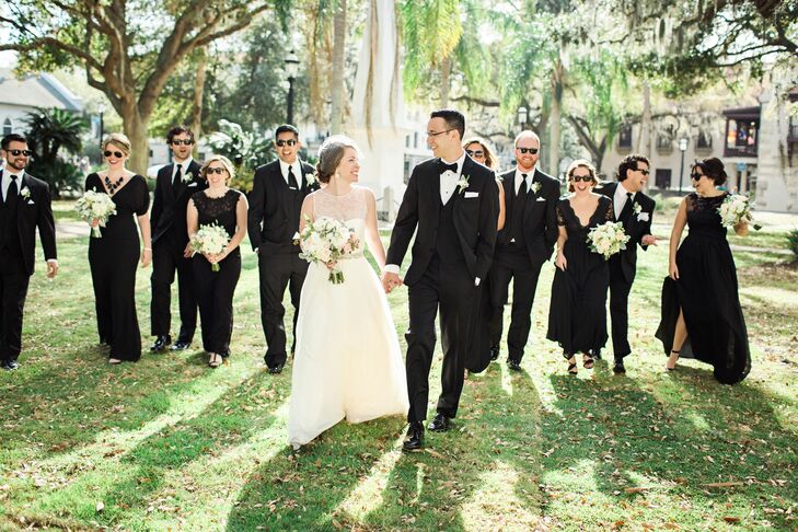 “We both wanted a classic look for our wedding,” says Alex. Bobby and his groomsmen donned classic black tuxedos for the wedding, which complemented each bridesmaid’s different style black floor-length dress.