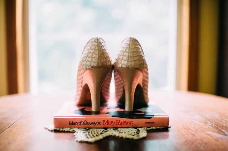 For her wedding heels, Kim had specific requirements. “I wanted vintage-looking shoes that were some form of pink or dusty rose and not too high,” she says. After searching through ModCloth, she found just that: Mary Jane heels with a neutral, antique-style patterns. Their double straps along the front and lower heels only added to the vintage look. (Since she loves Disney, it's "Mary Poppins" stand was no surprise either.)