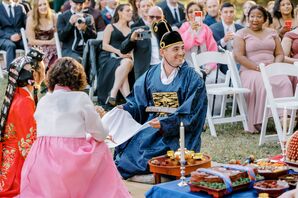 Groom in Korean Paebaek Robe Smiling at Altar During Traditional Ceremony