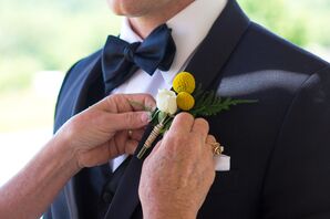 Yellow Boutonniere with Black Bow Tie