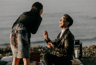 Man proposing to woman on a san diego beach