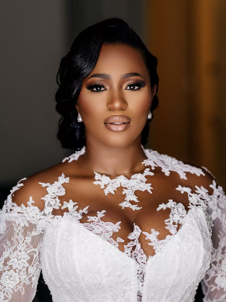 Bride poses with pearl earrings